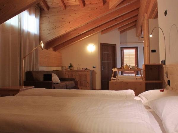 Immagine con prospettiva di una family room in Livigno