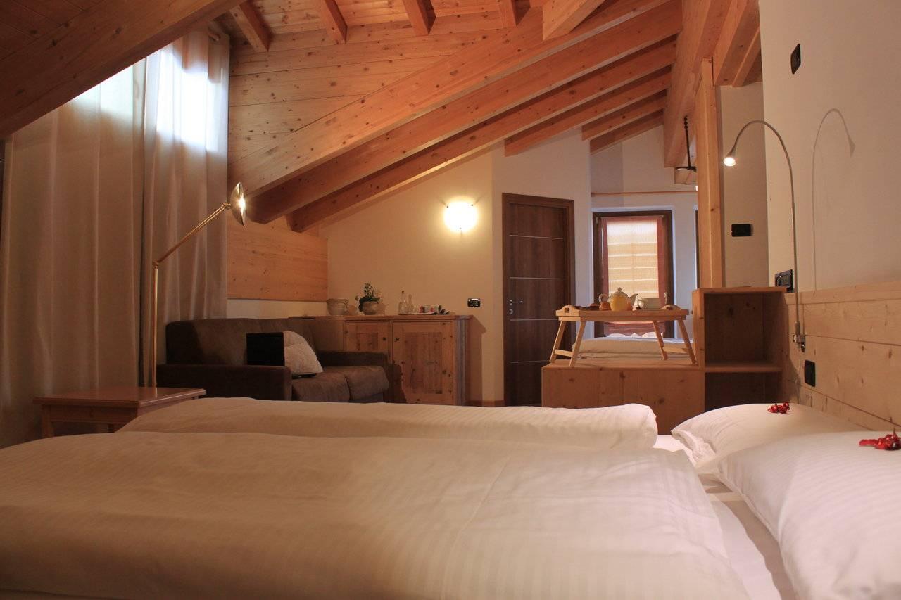 Immagine con prospettiva di una family room in Livigno